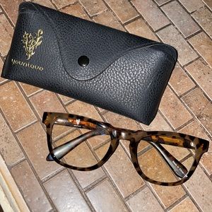 Younique cheetah print blue light glasses with case.